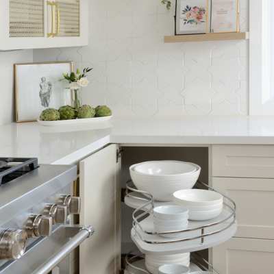 custom built cabinetry shelves for dishware in designer kitchen